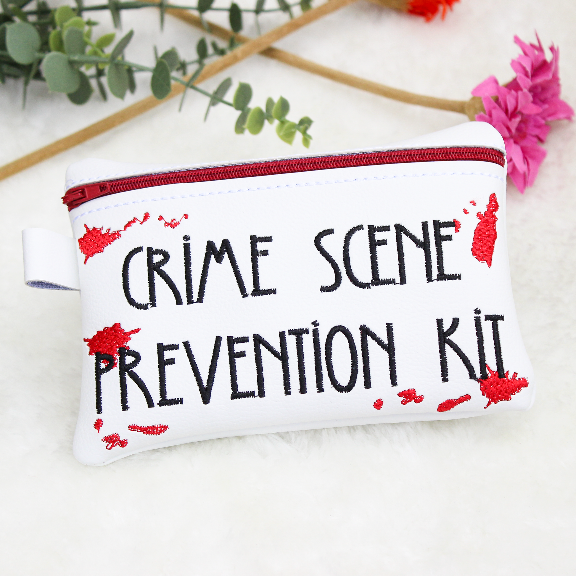 White period pouch pouch with 'Crime Scene Prevention Kit' text on a light background